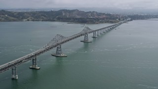AX0175_0050 - 6K aerial stock footage of flying beside the Richmond Bridge, California