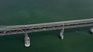 AX0175_0051 - 6K aerial stock footage of tracking a car on the Richmond Bridge, California