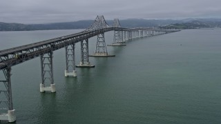 AX0175_0053 - 6K aerial stock footage of following the Richmond Bridge across San Francisco Bay, California