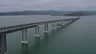 AX0175_0054 - 6K stock footage aerial video pan across the Richmond Bridge, fly over the bridge toward San Quentin, California