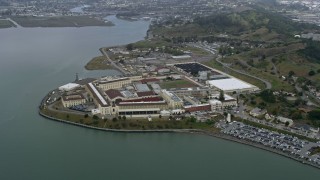 AX0175_0056 - 6K aerial stock footage approach and tilt to San Quentin Prison, California