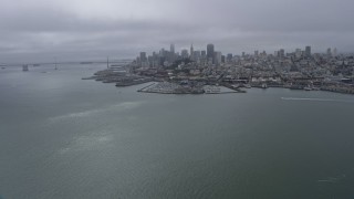 AX0175_0071 - 6K aerial stock footage a wide view of the Downtown San Francisco skyline on a foggy day, California