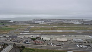 AX0175_0091 - 6K aerial stock footage of approaching runways at Oakland Airport, California