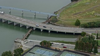 AX0175_0096 - 6K stock footage aerial video cars on a small bridge in Alameda, California