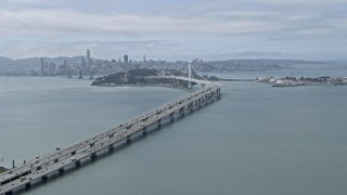 AX0175_0103 - 6K aerial stock footage tilting up for a view of the Bay Bridge, California
