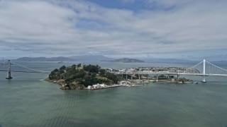 AX0175_0112 - 6K aerial stock footage of flying by Yerba Buena Island in San Francisco Bay, California