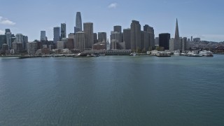 AX0175_0116 - 6K aerial stock footage ascend over Ferry Building and Downtown San Francisco, California