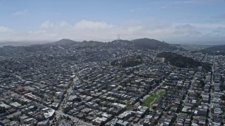 AX0175_0119 - 6K aerial stock footage of flying over urban neighborhoods toward Sutro Tower, San Francisco, California