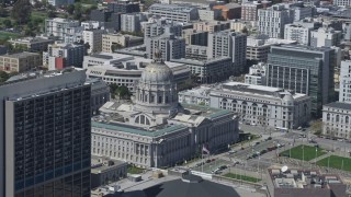 AX0175_0138 - 6K aerial stock footage of passing city hall in Civic Center, San Francisco, California