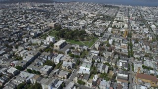 AX0175_0139 - 6K aerial stock footage of fly over urban neighborhoods to circle Alamo Square, Western Addition, San Francisco, California