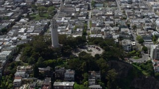 AX0175_0151 - 6K aerial stock footage of orbiting Coit Tower in North Beach, San Francisco, California
