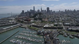 AX0175_0154 - 6K aerial stock footage tilt to reveal Pier 39, Coit Tower and Downtown San Francisco, California