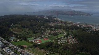 AX0175_0161 - 6K aerial stock footage tilt from Inner Richmond to reveal The Presidio and Golden Gate Bridge, San Francisco, California