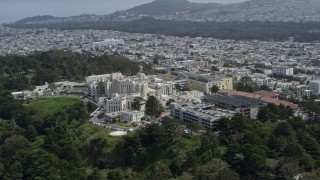 AX0175_0181 - 6K stock footage aerial video of orbiting a hospital overlooking the ocean, Seacliff, San Francisco, California