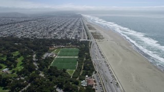AX0175_0182 - 6K aerial stock footage of flying over Golden Gate Park and beach toward Outer Sunset, San Francisco, California