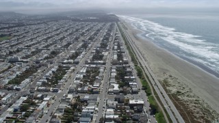 AX0175_0183 - 6K aerial stock footage of flying over Outer Sunset District toward Ocean Beach, San Francisco, California