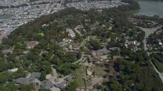AX0175_0187 - 6K aerial stock footage of flying by the zoo in Lakeshore, San Francisco, California