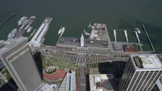 AX0175_0201 - 6K aerial stock footage of tilting to a bird's eye view of the Ferry Building in downtown, San Francisco, California