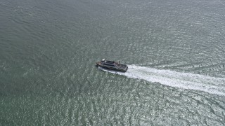 AX0175_0205 - 6K aerial stock footage of tracking a ferry sailing on San Francisco Bay, California