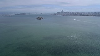 AX0175_0211 - 6K aerial stock footage approaching Alcatraz with view of Downtown San Francisco skyline, California