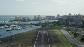 AX101_001E - 4.8K aerial stock footage Taking Off from Isla Grande Airport, San Juan Puerto Rico