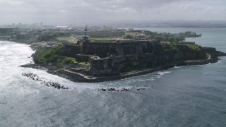 AX101_014 - 4.8K aerial stock footage of a Historic fort along the coast, Old San Juan Puerto Rico