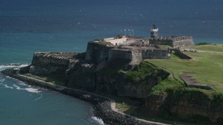 AX101_017 - 4.8K aerial stock footage of a Historic fort along the coast in the blue waters of the Caribbean, Old San Juan Puerto Rico