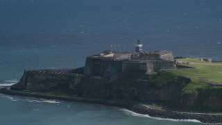 AX101_020 - 4.8K aerial stock footage of a Historic fort on the coast in the blue Caribbean waters, Old San Juan Puerto Rico