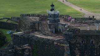 AX101_023E - 4.8K aerial stock footage of a Historic fort and lighthouse, Old San Juan Puerto Rico