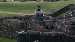 AX101_025 - 4.8K aerial stock footage of a Historic fort and lighthouse, Old San Juan Puerto Rico