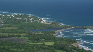 AX101_031E - 4.8K aerial stock footage of a Resort town along the blue Caribbean coastal waters, Dorado, Puerto Rico