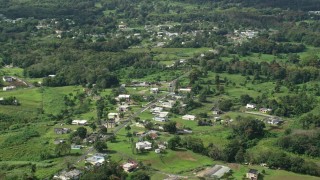 AX101_043 - 4.8K stock footage aerial video of Rural neighborhood with lush green grass and trees, Vega Baja, Puerto Rico 