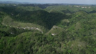 AX101_051 - 4.8K aerial stock footage Flying over jungle mountains, Karst Forest, Puerto Rico 
