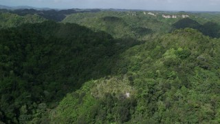 AX101_052 - 4.8K aerial stock footage Flying over mountains and jungle, Karst Forest, Puerto Rico 