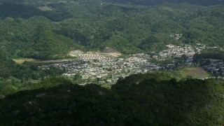 AX101_065 - 4.8K aerial stock footage of a Town nestled among lush green trees, Florida, Puerto Rico 