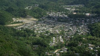 AX101_066 - 4.8K aerial stock footage of a Town nestled among lush green trees, Florida, Puerto Rico 
