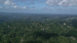 AX101_068 - 4.8K aerial stock footage of Limestone cliffs and lush green jungle, Karst Forest, Puerto Rico 