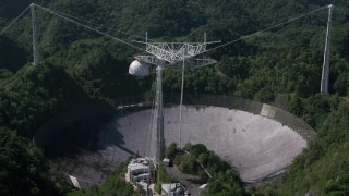 AX101_093 - 4.8K stock footage aerial video of Arecibo Observatory in lush green Karst forest, Puerto Rico
