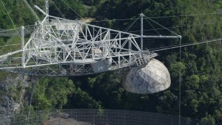 AX101_099 - 4.8K aerial stock footage Flying along the top of Arecibo Observatory, Puerto Rico 
