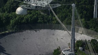 AX101_103E - 4.8K aerial stock footage Close up of Arecibo Observatory, Puerto Rico