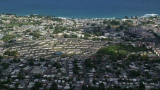 AX101_134E - 4.8K aerial stock footage of the Coastal homes and apartment buildings, Arecibo, Puerto Rico