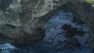 AX101_164 - 4.8K aerial stock footage of Rock formations on the coast, Arecibo, Puerto Rico 