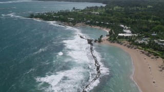 AX101_214 - 4.8K aerial stock footage of a Beach and private resort along pristine blue waters, Dorado, Puerto Rico 