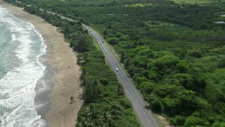 AX101_222 - 4.8K aerial stock footage of a Coastal highway and beach, Dorado, Puerto Rico 