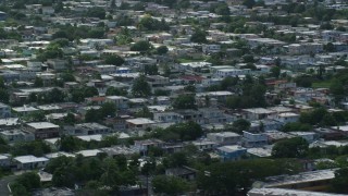 AX101_229E - 4.8K aerial stock footage of neighborhood houses, Toa Baja, Puerto Rico