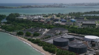 AX101_232 - 4.8K stock footage aerial video of a Bacardi Rum Factory along crystal blue waters, Cataño Puerto Rico
