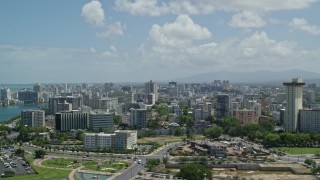 AX102_001 - 4.8K aerial stock footage of an Apartment and office buildings near the water, San Juan, Puerto Rico