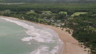 AX102_040 - 4.8K aerial stock footage of a Beachside resort, St. Regis, Rio Grande, Puerto Rico 