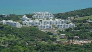 AX102_057E - 4.8K aerial stock footage of The Ocean Club at Seven Seas vacation resort, Fajardo, Puerto Rico