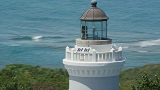 AX102_068 - 4.8K aerial stock footage Orbiting Cape San Juan Light and crystal blue water, Puerto Rico 